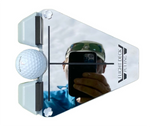 Close-up of the Flight Deck Putting Tour Kit mirrored surface reflecting a golfer's eye position overhead, with golf ball seated in the gate and alignment crosshair visible