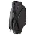 Three-quarter view of the Fourteen Golf caddie bag in black showing the full pocket configuration, carry strap, carabiner hardware, and branded strap detail