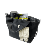 Fourteen Golf black cart tote bag open from top showing interior storage with water bottle, pack of Tour Tees, and white golf glove tucked into front pocket