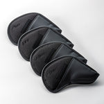 Set of four Fourteen Golf black iron head covers (PW, L, AW, SW) displayed in diagonal stack on white background, all-black colorway with embossed club designations and FOURTEEN branding