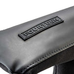 Close-up of Fourteen Golf black putter headcover crown showing smooth PU leather panel with raised FOURTEEN rubber badge and ballistic nylon body with stitched trim detail