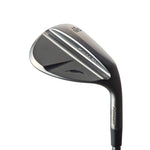 A black golf wedge with a metallic finish, showing the clubface, shaft, and part of the hosel.