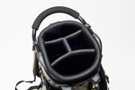 Top-down view of Fourteen Golf stand bag showing four-way divider system with mesh-lined club compartments and padded carry handle with dual strap attachment hardware