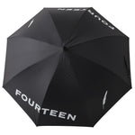 Fourteen Golf black golf umbrella fully open top-down view showing FOURTEEN wordmark and feather logo printed in white across canopy panels, on white background