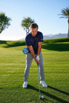 The PLANEMATE golf training aid in use golfer impact position on course