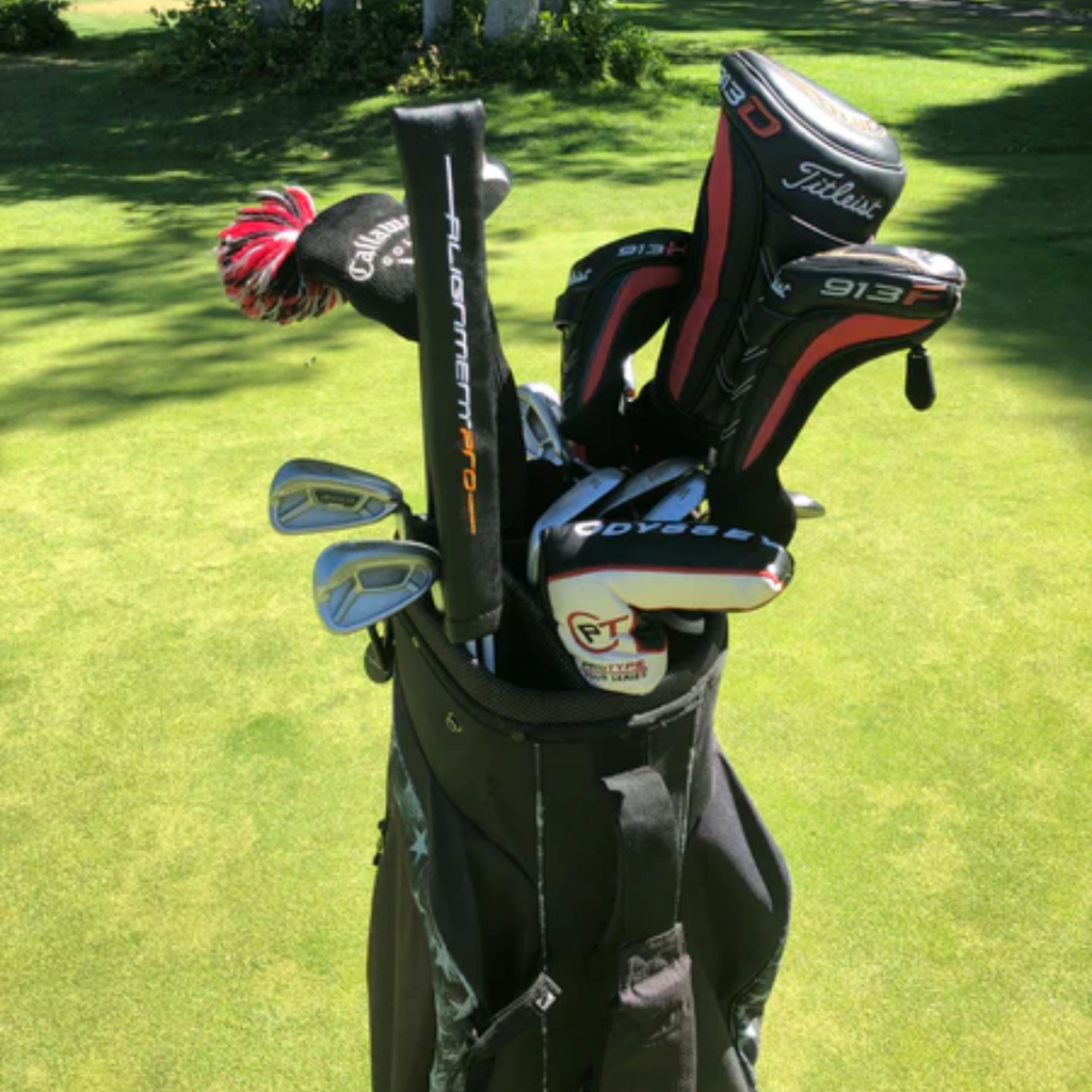 Alignment sticks cover in black inside a golf bag