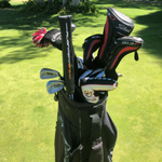 Alignment sticks cover in black inside a golf bag