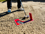 Wedge address position behind a golf ball set up on the EyeLine Golf Bunker Pro System board with entry peg in position in a bunker