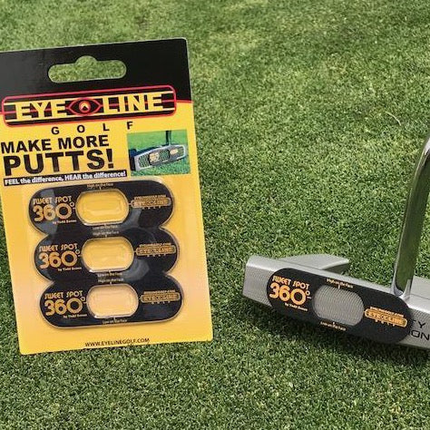 Three pieces of the Eyeline Golf 360 Sweet Spot training aid placed on a golf course, with the packaging showing the product name and logo.