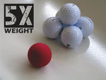 EyeLine Golf Ball of Steel red weighted training ball beside five standard white golf balls, illustrating its 5x weight comparison