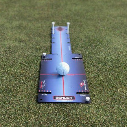 EyeLine Bender Putting Board with golf ball at address showing path guides, tee slots and red centre line