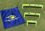 EyeLine Golf Putting Path Gates 3-piece set in three sizes laid out on the green alongside the blue EyeLine Golf drawstring carry bag