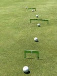 Three EyeLine Golf Putting Path Gates set up in a line on the green at increasing distances toward the hole, with golf balls placed at each gate for progressive putt accuracy drills