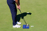 Golfer at address using the EyeLine Golf putting alignment mirror on the green, with two additional balls positioned nearby for continued practice