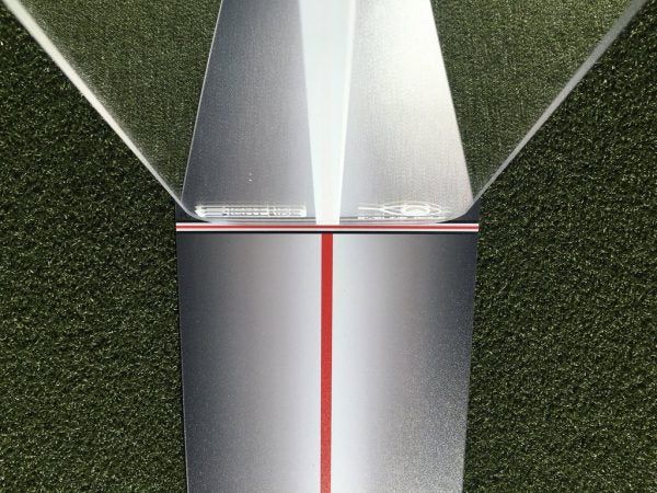 Close-up of the EyeLine Golf Sight Line putter gate end, showing the red centre line and angled reflective wings used to check eye position and face alignment
