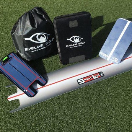 A collection of golf training aids from Eyeline Golf including a sight line base, a putting alignment mirror with level, a vertical mirror with level and stand, and a carry bag, displayed on a green surface.