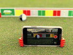 Close-up of MyRoll ball striking the EyeLine Golf SloMo Screen, showing the two-tone ball design used to reveal topspin and backspin