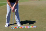 Golfer at address with putter and MyRoll ball positioned in front of the EyeLine Golf SloMo Screen, ready to capture ball roll on video