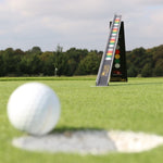 Golf ball rolling toward the EyeLine Golf Sweet Roll Rail System on the green, with the colour-coded ramp visible in the background for putt quality feedback