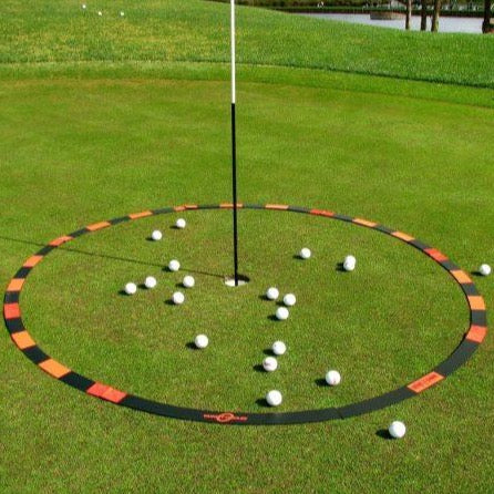 Eyeline Golf Target Circle surrounding a putting hole with multiple golf balls scattered inside, used for distance control and lag putting practice on the green