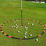 Eyeline Golf Target Circle surrounding a putting hole with multiple golf balls scattered inside, used for distance control and lag putting practice on the green